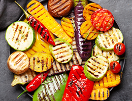 A colorful variety of grilled vegetables on a plate.